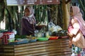People buy food on Pasar ndeso Sor Preng Mojo. Pasar ndeso means a traditional market that sells Indonesian traditional snacks and