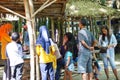 People buy food on Pasar ndeso Sor Preng Mojo. Pasar ndeso means a traditional market that sells Indonesian traditional snacks and