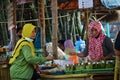 People buy food on Pasar ndeso Sor Preng Mojo. Pasar ndeso means a traditional market that sells Indonesian traditional snacks and