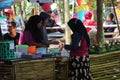 People buy food on Pasar ndeso Sor Preng Mojo. Pasar ndeso means a traditional market that sells Indonesian traditional snacks and