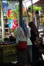 People buy food on Pasar ndeso Sor Preng Mojo. Pasar ndeso means a traditional market that sells Indonesian traditional snacks and