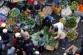 People buy and sell fruit at market.DA LAT, VIET NAM- FEBRUARY 8, 2013 Royalty Free Stock Photo