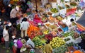 People buy and sell fruit at market. DA LAT, VIET NAM- FEBRUARY 8, 2013 Royalty Free Stock Photo