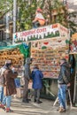 People buy souvenir celebrity figurines at the Caganer street stall in Barcelona Royalty Free Stock Photo