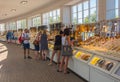 People buying amber jewellery and souvenirs in the market in Sopot, Poland.