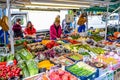 People buying fruits and vegetables at market stall in Portobello Road Market, Notting Hill, United Kingdom