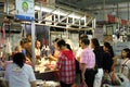 People buying meat in Asian market