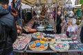 People buying oriental souvenirs at the street shop Royalty Free Stock Photo