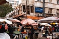 People buying and selling food on street market in Damascus, Syria