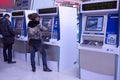 People buying ticket automatic machine