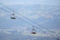 .People cable car in the mountains on the background of the city in the mountain valley Royalty Free Stock Photo