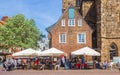 People at a cafe in front of the Liebfrauenkirche church in Bremen