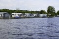 People camping with a caravan next to a lake in National Park Weerribben-Wieden, The Netherlands