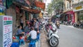 People can seen having their food beside the street in the morning at Hanoi, Vietnam. Royalty Free Stock Photo