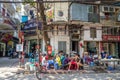 People can seen having their food beside the street in the morning at Hanoi, Vietnam. Royalty Free Stock Photo