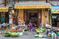 People can seen having their food beside the street and various types of fruits selling from the traditional hanging baskets can f Royalty Free Stock Photo