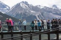 People on the Canadian Skywalk looking at the Rockies