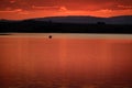 People Canoeing On Lake At Sunset Relaxing Vacation Fun Royalty Free Stock Photo