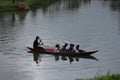 people on canoes on an Indonesian lake