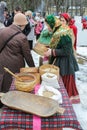 People at the carnival at the table with the grain.