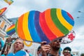 People carry lgbt hearts at the LGBT parade