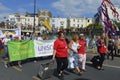 People carrying flags and banners in the colourful Margate Gay pride Parade Royalty Free Stock Photo