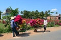 People carrying flowers to the market in Mekong Delta, Vietnam