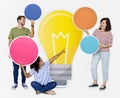 People carrying light bulb icons Royalty Free Stock Photo