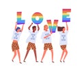 People carrying LOVE letters in rainbow colors isolated on white background. Lgbtq activists in costumes taking part in