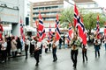 People Carrying Norwegian Flags On National Day Parade