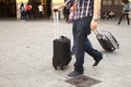 People carrying their suitcase