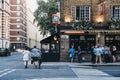 People and cars in front of Mabel`s Tavern pub, King`s Cross, Lo