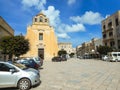 People and cars near the church of the Piazza Matrice in Favigna Royalty Free Stock Photo
