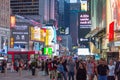 People and cars at Times Square at night . Royalty Free Stock Photo