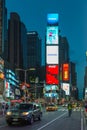 People and cars at Times Square at night . Royalty Free Stock Photo