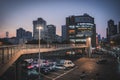People, cars, traffic and lights of a local street in Tang Qiao area, Shanghai, China Royalty Free Stock Photo