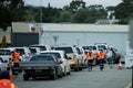 People in cars wait in queue to get Covid-19 test at coronavirus drive through testing site in Melbourne