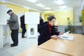 People casting ballots on elections to State Duma