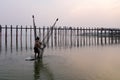 People catch fish near Ubein bridge in Mandalay, Myanmar