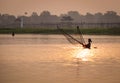 People catch fish on the river in Yangon, Myanmar