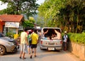 People catch a local bus in Krabi, southern Thailand