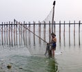 People catching fish on the lake at sunset in Myanmar Royalty Free Stock Photo