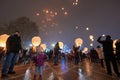 People celebrate and make fire lanterns.