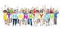 People Celebrating and Holding Word Thank You Royalty Free Stock Photo