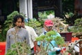 People checking and scoring bonsai on bonsai festival in Kediri