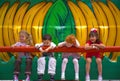 People-Children sitting on a Ride Smiling