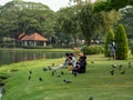 People chilling out in the public park, where is in the center of Bangkok Royalty Free Stock Photo