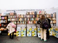 People choose old books on antiques booth