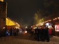 People at Christmas market at old castle by night