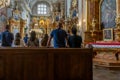 People at the church. Prayer in the Cathedral. Warsaw, Poland - July 27, 2023